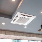 Modern ceiling mounted cassette type air conditioning system in coffee shop